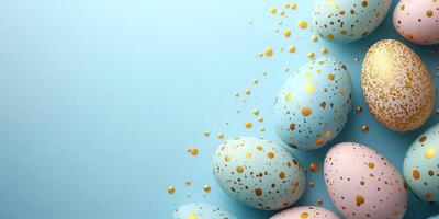 Colorful decorative Easter eggs on a blue background with golden speckles and smooth surfaces photo