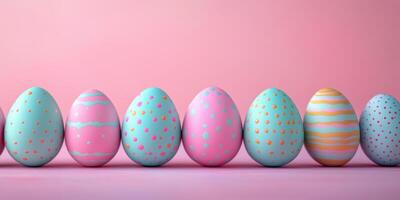 Colorful decorated Easter eggs arranged on a pastel pink backdrop for festive celebration photo