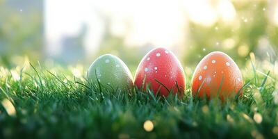 Colorful Easter eggs resting in vibrant green grass during a sunny spring day photo