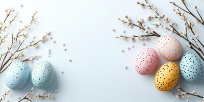 Colorful Easter eggs arranged with floral branches on a soft blue background creating a festive spring atmosphere photo