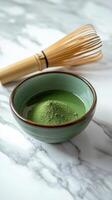 serene matcha preparation scene featuring bowl of green powder and bamboo whisk, evoking tranquility and mindfulness photo