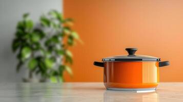 vibrant orange pot sits on marble countertop, surrounded by greenery, creating warm kitchen atmosphere photo