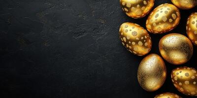 Beautifully decorated golden eggs arranged on a dark textured surface celebrating a festive occasion photo