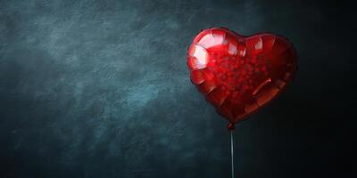 Heart-shaped balloon with confetti on a dark background creates a festive atmosphere for celebrations or romantic occasions photo
