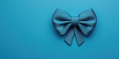 Turquoise decorative bow on a vibrant blue background, ideal for celebrations and gifts photo