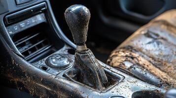 Moldy car interior with gear lever covered in fungus and dirt photo