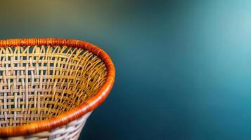 Woven rattan basket with natural aesthetic against green background, perfect for home decor photo