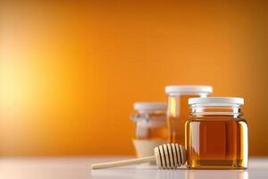 Locally sourced honey in glass jars with wooden dipper, showcasing natural sweetness and warmth photo