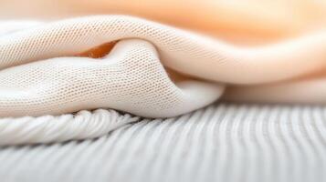 Soft organic linen and cotton fabrics in neutral tones, showcasing texture and warmth. Perfect for sustainable fashion and home decor photo
