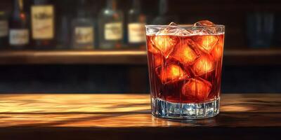 Refreshing cocktail with ice served in a glass on wooden bar counter in low light setting photo