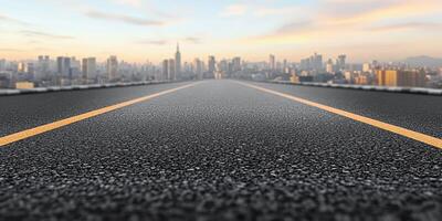 City skyline view with a deserted road stretching forward during sunset photo