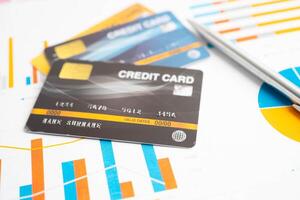Credit card on graph paper for online shopping, security finance b photo