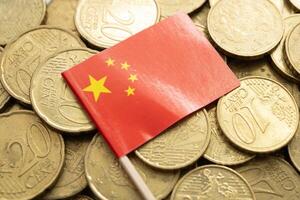 China flag on coins background, finance and accounting, banking concept. photo