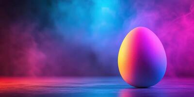 Colorful egg illuminated by vibrant lights in a misty atmosphere during a creative display photo