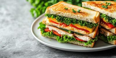 Delicious vegetarian sandwich stacked with fresh lettuce, tomatoes, and cheese on a gray plate in a cozy setting photo