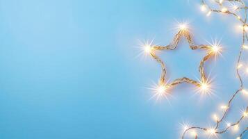 Christmas lights forming a bright star shape decoration on a pale blue background, perfect for holiday season greeting card or website banner Copy space for text photo