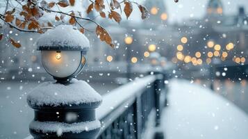 Christmas lights and colorful baubles decorating a snow covered winter city bridge railing at twilight, with a cityscape and falling in the background photo