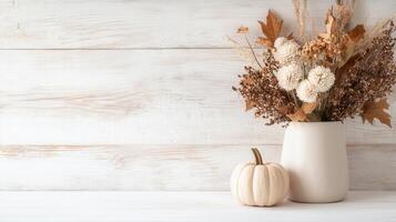 White and orange pumpkins with autumn maple leaves cozy thanksgiving atmosphere on light wooden table copy space for text photo