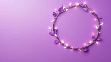 Christmas lights illuminating white creating oval frame on light purple background, perfect for winter holidays greeting card photo