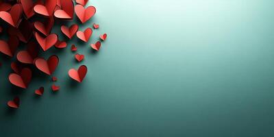Decorative red paper hearts arranged creatively on a soft teal background for celebrations and romantic occasions photo