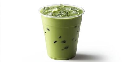 Refreshing iced matcha drink served in a transparent plastic cup on a white background photo