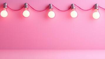 Lit christmas light bulbs hanging from a pink string against a pink wall create a warm, inviting atmosphere background Copy space for text photo