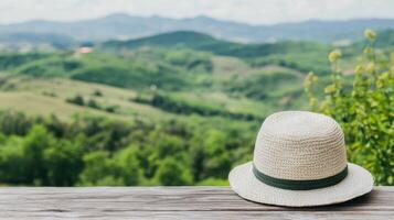 White hat on wood table at countryside travel photo
