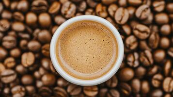 Top view of latte coffee cup on Coffee beans photo