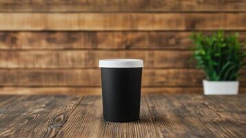 Paper coffee cup on wooden table photo