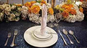 set of plates, spoons, forks, knives for dinner banquets with flower decoration photo