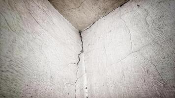 corner wall with grunge textured and crack effect photo