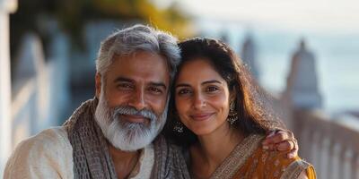 Couple enjoying a peaceful moment by the seaside during sunset in a serene coastal location photo