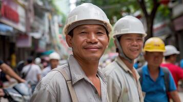 Smiling asian workers in white hardhats on bustling city street portrait image. Colleagues hardworking team picture photorealistic. Skilled laborers occupation concept photo realistic