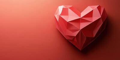 Heart-shaped geometric art piece in vibrant red tones on a warm background photo