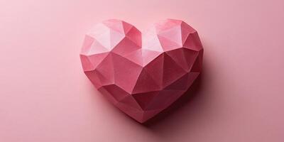 Heart-shaped geometric sculpture made of pink material on a smooth background showcasing artistic design and contemporary style photo