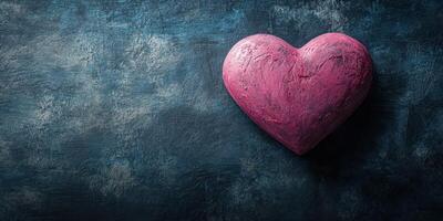 Heart sculpture with textured finish on a dark blue background creating a contrast in artistic presentation photo