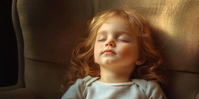 Child peacefully sleeping in a cozy armchair with soft sunlight illuminating her face photo