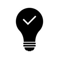 A black light bulb with a tick mark on it vector