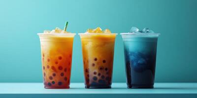 Colorful bubble tea drinks arranged on a countertop with a light blue background photo