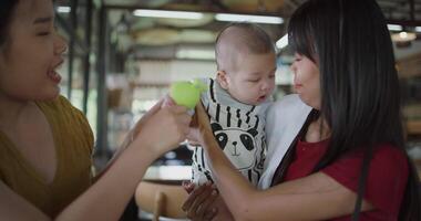 Happy family having fun with little son at table in cafe. Happy lifestyle. video