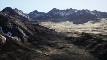A view of a mountain range from the top of a hill video