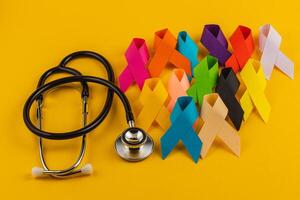 Global cancer awareness ribbons and stethoscope promoting health awareness photo