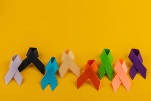Colorful awareness ribbons representing various health campaigns and diseases photo