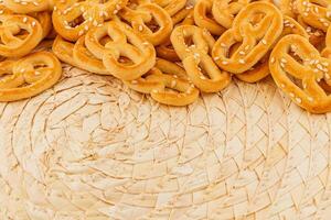 Freshly baked pretzels arranged on a woven mat for a delightful snack photo
