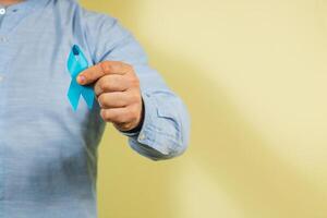 Support for mens health with awareness ribbon on international cancer day photo