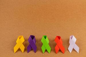 Colorful ribbons symbolize awareness for various health conditions photo