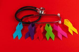 Colorful awareness ribbons and stethoscope promoting cancer care and support photo
