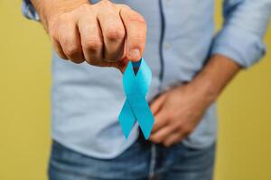 Highlighting awareness for prostate cancer with a blue ribbon photo