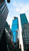 New York City, USA, August 14, 2024. Nice vertical footage of the skyscraper with the distinctive observation deck the edge. It juts out conspicuously from the skyscraper's silhouette. video