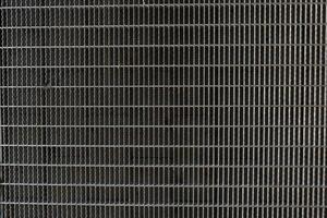 A background image of a gray steel grating panels. photo